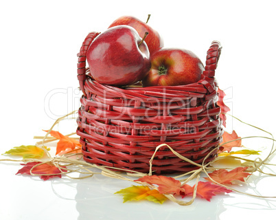 Red apples in wood basket