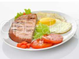 Sliced grilled ham with egg and vegetables