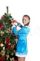 Young christmas girl decorate new year fir tree