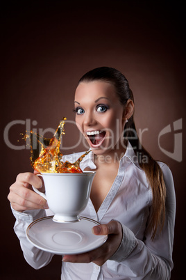 funny Woman with cup and splash of tea smile
