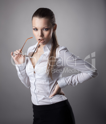 Sexy business woman take glasses off