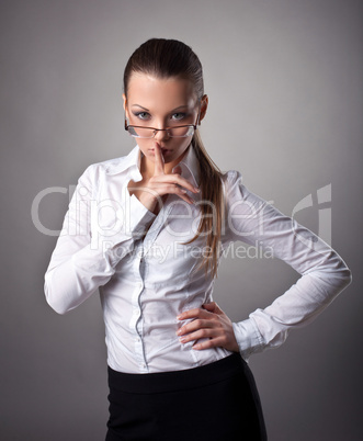 Sexy business woman silence sign