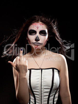 Young woman in day of the dead mask skull face art