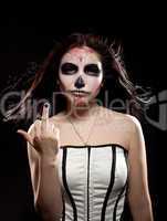 Young woman in day of the dead mask skull face art