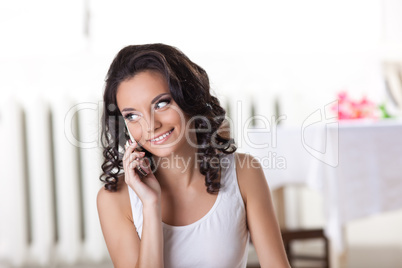 Cute woman in tank top call a phone