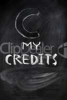 Credits sign on a blackboard
