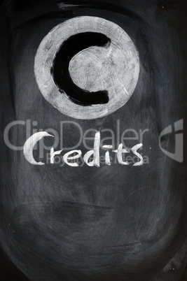Credits sign on a blackboard