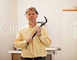 Senior man holding a crowbar
