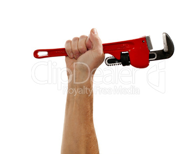 Senior man holding a large wrench