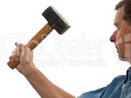 Senior man holding a large hammer