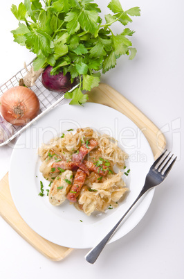 silesian potato dumplings with smoked pork and sauerkraut