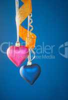 Two heart shaped toys hanging