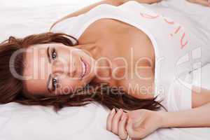 Beautiful Young Woman On Bed