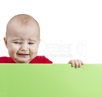 sad young child holding shield