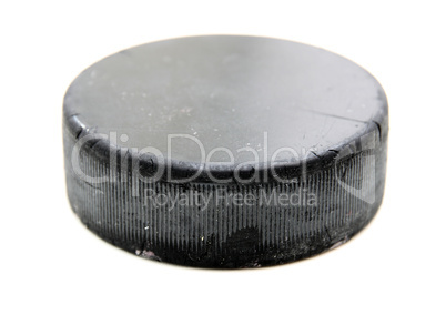 Black old hockey puck