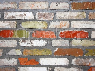 Old wall consisting of bricks of different color
