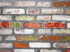 Old wall consisting of bricks of different color