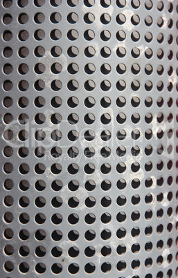 metal holed or perforated grid background