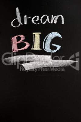 Dream big text written on a blackboard
