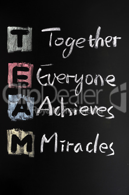 TEAM acronym written in colorful chalk