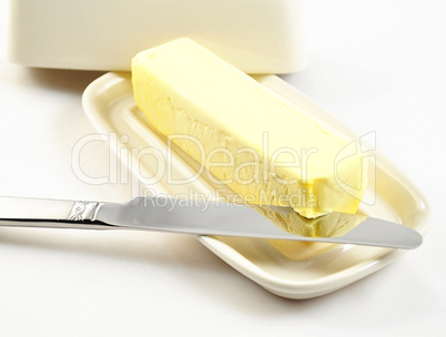 butter on a white butterdish