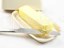 butter on a white butterdish