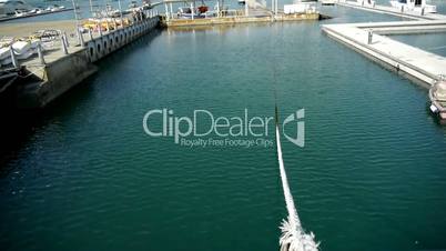 cable tie yacht on water at Pier of QingDao city Olympic Sailing Center,tsingtao,Tower,building,skyscraper,architecture,urban,modern.