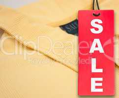 Sale Tag and Polo Shirt