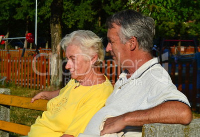 Elderly couple (60s) relaxing.