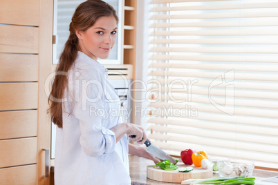 Woman slicing a pepper