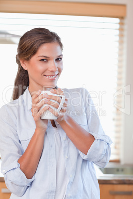 Portrait of a woman holding a cup of tea