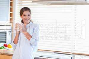 Happy woman holding a cup of tea