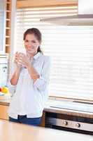 Portrait of a calm woman holding a cup of tea