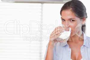 Happy woman drinking a glass of water