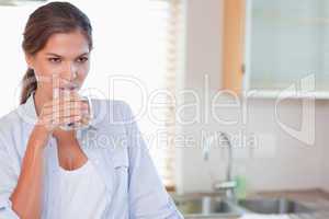 Beautiful woman drinking a glass of water