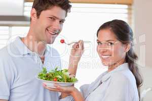 Housewife feeding her husband