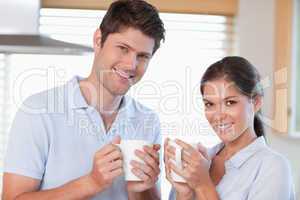 Happy couple drinking coffee