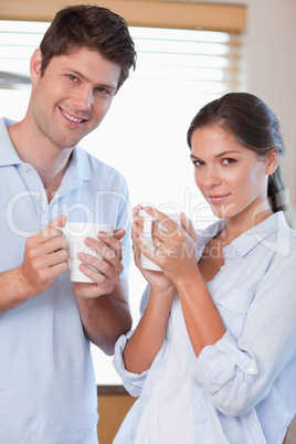 Portrait of a couple drinking tea