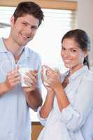 Portrait of a couple drinking coffee