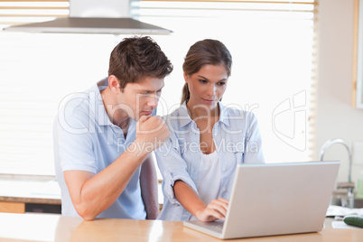 Couple using a laptop