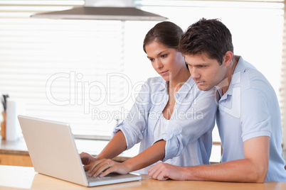 Couple using a notebook