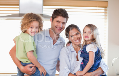 Smiling family posing