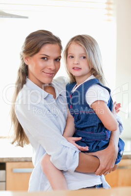 Portrait of a mother and her daughter posing