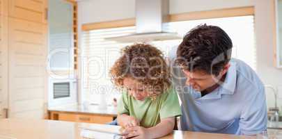 Boy and his father using a tablet computer