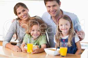 Happy family having breakfast