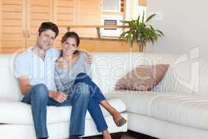 Couple sitting on a sofa