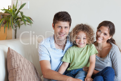 Family sitting on a sofa