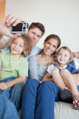 Portrait of a happy family taking a photo of themselves