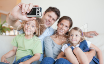 Happy family taking a photo of themselves