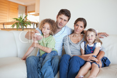 Family watching TV together